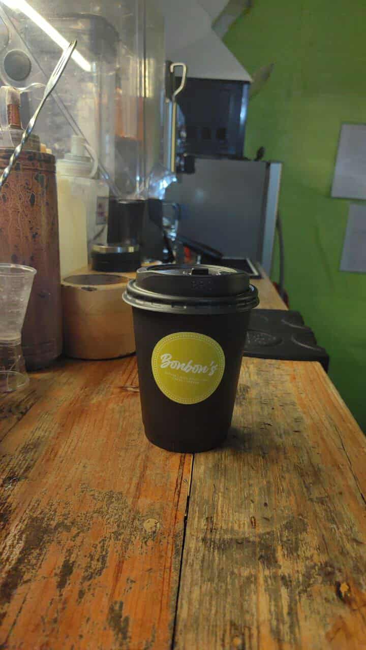 Counter filled with drinks and pastries